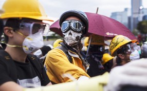 Pro-democracy protesters occupy Lung Wo Road, next to the Hong Kong Chief Executive's Office, part of the Central Government Office complex that the protesters are trying to surround. Photo: EPA