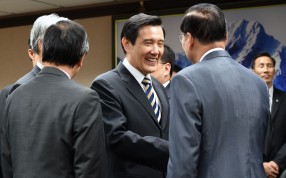 Taiwan President Ma Ying-jeou shakes hands with officials at the Mainland Affairs Council in Taipei on Wednesday. Ma defended his "one China" policy, saying it has brought peace to the Taiwan Strait. Photo: AFP