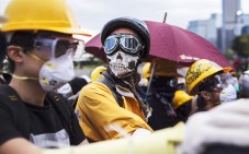 Pro-democracy protesters occupy Lung Wo Road, next to the Hong Kong Chief Executive's Office, part of the Central Government Office complex that the protesters are trying to surround. Photo: EPA