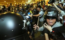 Police officers clash with pro-democracy protesters outside Central Government Offices in Admiralty. Photo: Felix Wong