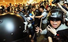 Police officers clash with pro-democracy protesters outside Central Government Offices in Admiralty. Photo: Felix Wong