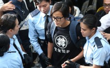 Police officers take away singer and actress Denise Ho Wan-see while police removed barricades and tear down tents at the Occupy protest site in Admiralty. Photo: K. Y. Cheng