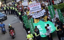 Pro-democracy locals march under police escort. Photo: K. Y. Cheng