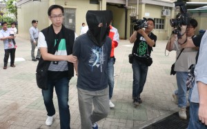 One of the suspects was picked up by police in Tsz Wan Shan at about 10am on Tuesday. Photo: SCMP
