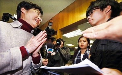 Joshua Wong (right) confronts Chief Secretary Carrie Lam. Photo: SCMP Pictures