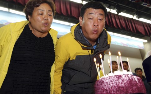 Parents blow candles off birthday cake for deceased daughter
