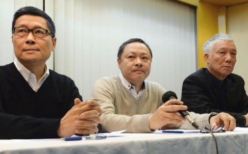 (From left) Chan Kin-man, Benny Tai and Chu Yiu-ming say they will surrender to police and call off the occupation campaign. Photo: Kyodo