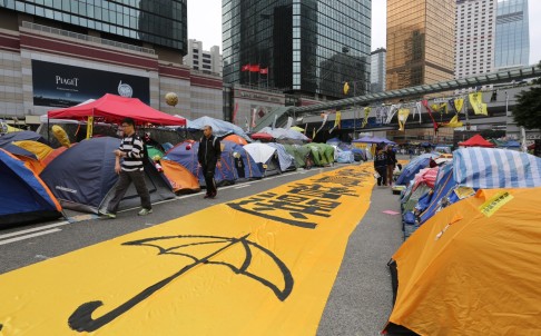 An image of a yellow umbrella is spread out on the road at the site of the Admiralty Occupy protest, on December 7. Photo: Sam Tsang
