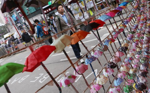 Paper umbrellas hang in Causeway Bay - for now at least. Photo: K.Y. Cheng