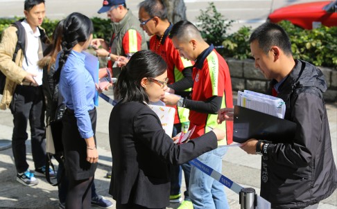 Potential police officers are interviewed during recruitment day yesterday at police HQ in Kowloon Bay. Photo: Edmond So