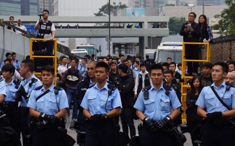 Hong Kong police clear the main pro-democracy Umbrella Movement site in Admiralty last Thursday. Photo: EPA
