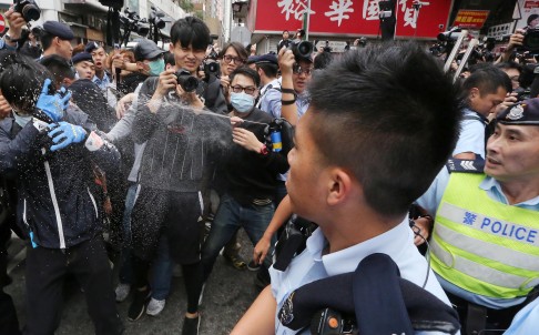 Police use pepper spray on protesters during yesterday's rally in Yuen Long. Photo: Felix Wong