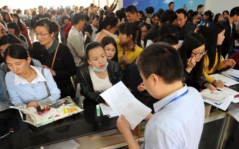 Job seekers apply for local teaching positions in Lianyungang, Jiangsu. Chinese officials are worried slowing growth could hit employment. Photo: Reuters