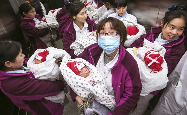 Critical move - Nurses carry newborn babies, suffering from critical diseases, in a lift as they transfer them to a new building at a hospital in the eastern city of Hangzhou in Zhejiang province. Local media said 38 children were moved to the new wing on Monday under police escort. This showed the sensitivity of the operation to transfer the children. Photo: Reuters
