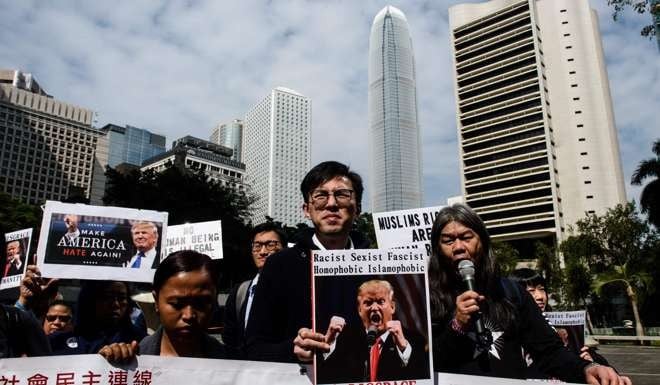 Members of the League of Social Democrats of pro-democracy party Avery Ng (C), Leung Kwok-hung also known as Long Hair (centre R) and other activists take part in a protest against US President Donald Trump and his recent immigration and refugee restrictions, in Hong Kong. Photo: AFP