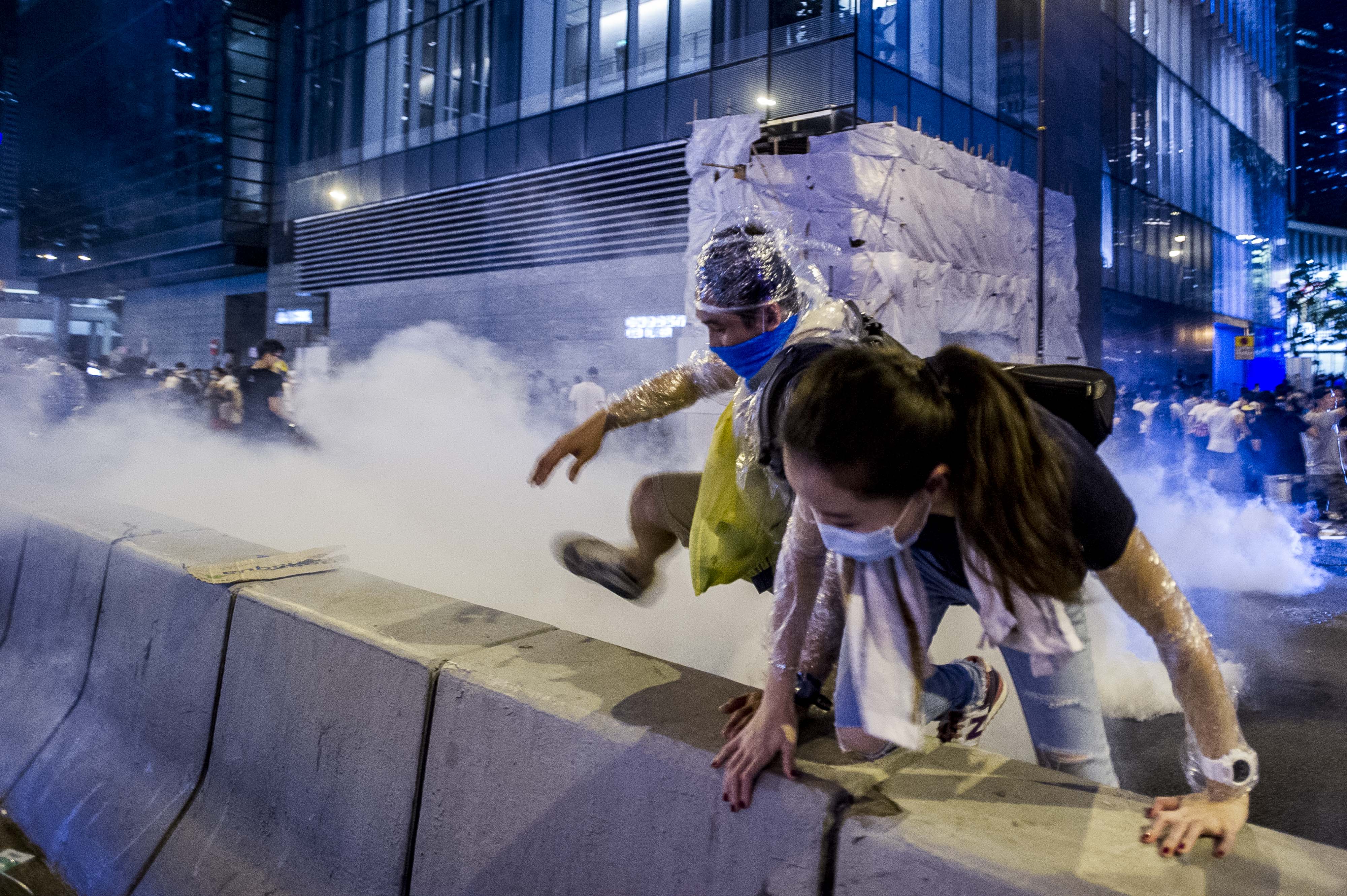 fleeing-tear-gas-afp.jpg