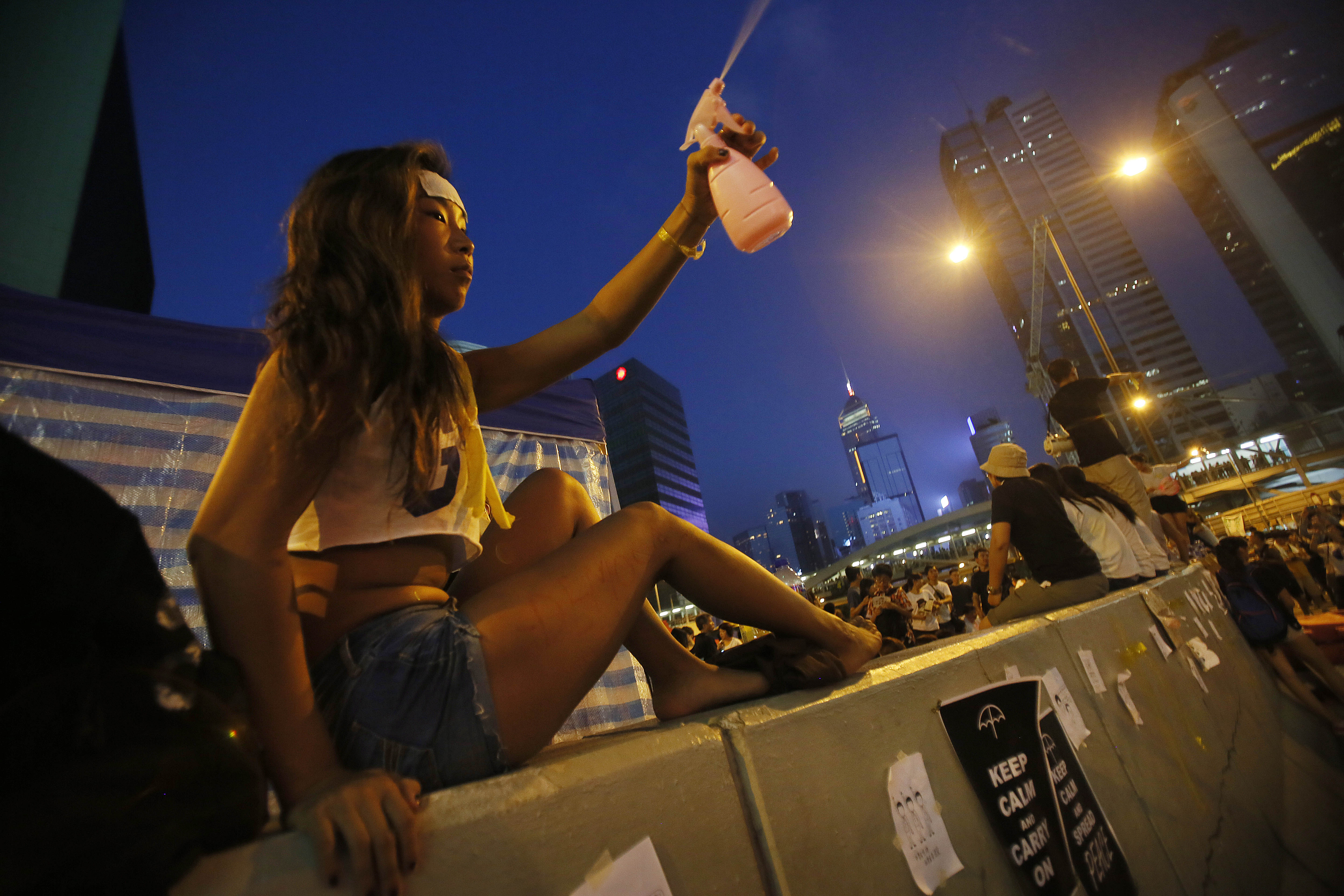 woman-protester-spray-water-cool-ap.jpg