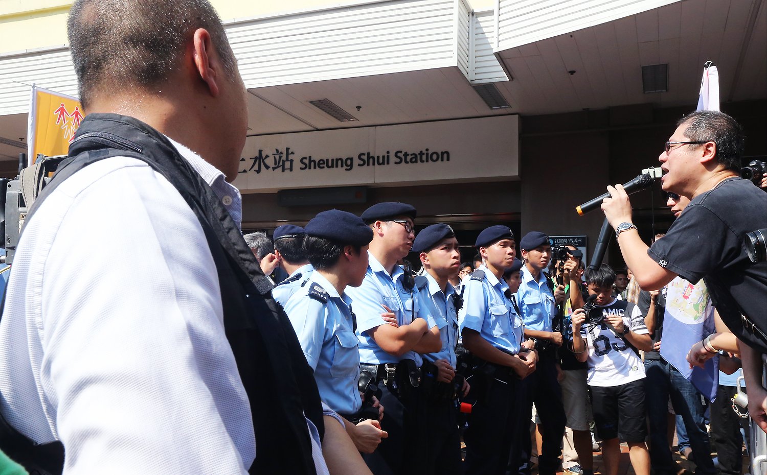 Members of Local League protest against parallel trading outside Sheung Shui MTR Station in Sheung Shui. Photo: David Wong/SCMP