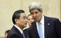 China's Foreign Minister Wang Yi (left) with US Secretary of State John Kerry. Photo: EPA