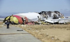 US investigators at the crash scene at San Francisco airport. Photo: AP