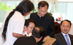 Zhang Xiaoming receives a book and a framed poem from Leung Kwok-hung. Photo: Sam Tsang