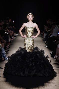 A contemporary black feather ruffled gown
