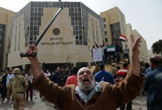 A man celebrates the withdrawal of police in Port Said, the main city along the Suez Canal, in March. Photo: AFP