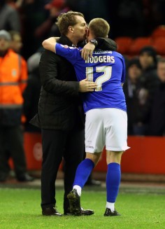 Liverpool manager Brendan Rodgers, kisses his son, Oldham's Anton Rodgers after their English FA Cup third-round match at Anfield. Photo: AP