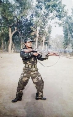Rai wields an assault rifle as a 15-year-old Maoist rebel in Nepal.