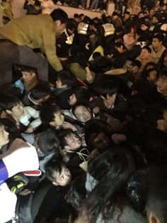 Revellers try to escape the stampede on the Bund.