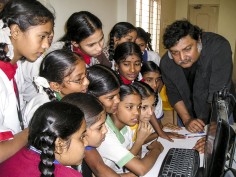 Sugata Mitra working with students in rural India in 2009.