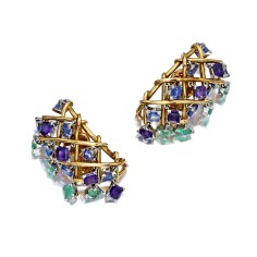 A pair of gems and gold ear clips by Schlumberger from the Bacall collection.