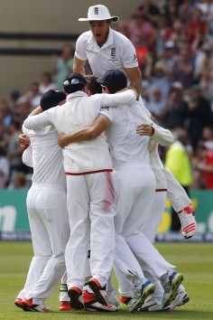 Stuart Broad (top) celebrates with his England teammates after they wrap up the fourth test and retain the Ashes. Photo: AFP