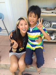 Filmmaker Zoey Lee with one of the children at Sun Village.