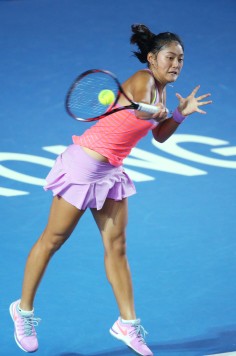 Wang Yafan of China hits a return to Venus Williams during their second round match. Photo: AP
