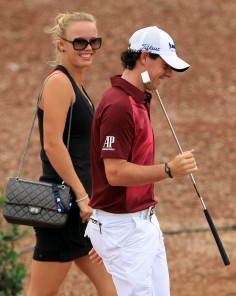 In 2012, Caroline Wozniacki chats with her then boyfriend Rory McIlroy at the Dubai Golf World Championship. Photo: EPA 