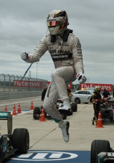 Lewis Hamilton is over the moon after matching his idol Ayrton Senna's record of three F1 titles. Photo: AFP   