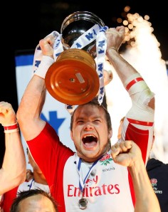 Ollie Phillips hoists the silverware after England beat New Zealand in the 2009 Wellington Sevens final.Photo: Reuters