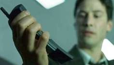 Neo, a character in The Matrix played by Keanu Reeves, uses a Nokia 8110 in a scene from the film.