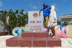 Tourists pose for photos on Yagong Island in the Paracels. Photo: Zhen Liu