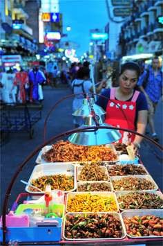 A street vendor selling fried insects in Bangkok, Thailand.