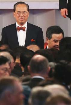 Former chief executive Donald Tsang attends a reception alongside his successor Leung Chun-ying. Photo: David Wong