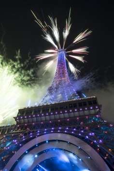 FFireworks from the replica Eiffel Tower entertained the crowds at the grand opening