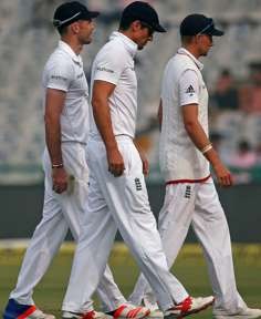 England's James Anderson (left), Alastair Cook and Joe Root trudge towards the pavilion during the tea break on the fourth day, knowing the game had been long lost at that point. Photo: Reuters