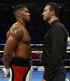 Joshua squares off with Klitschko after his win. Photo: Reuters