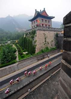 Members of China's cycling team pass between two towers of the Great Wall in Badaling, north of Beijing, during a training session on August 4, 2008, ahead of the opening of the 2008 Olympic Games. Picture: AFP