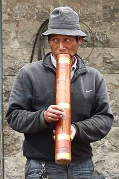 A man smokes a pipe in Yunnan.