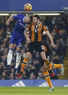 Cahill and Mason challenge for the ball. Photo: AP