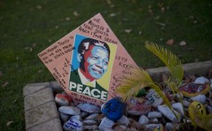 Messages for Nelson Mandela are pictured outside of his Johannesburg home. Photo: AFP