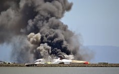 Asiana Airlines flight 214 burns on the runway at San Francisco International Airport after a crash landing. Photo: Reuters